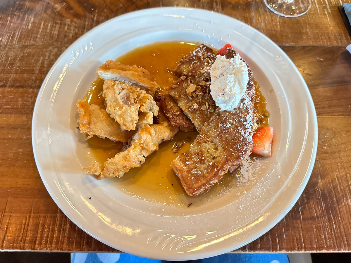 chicken and french toast on a white plate